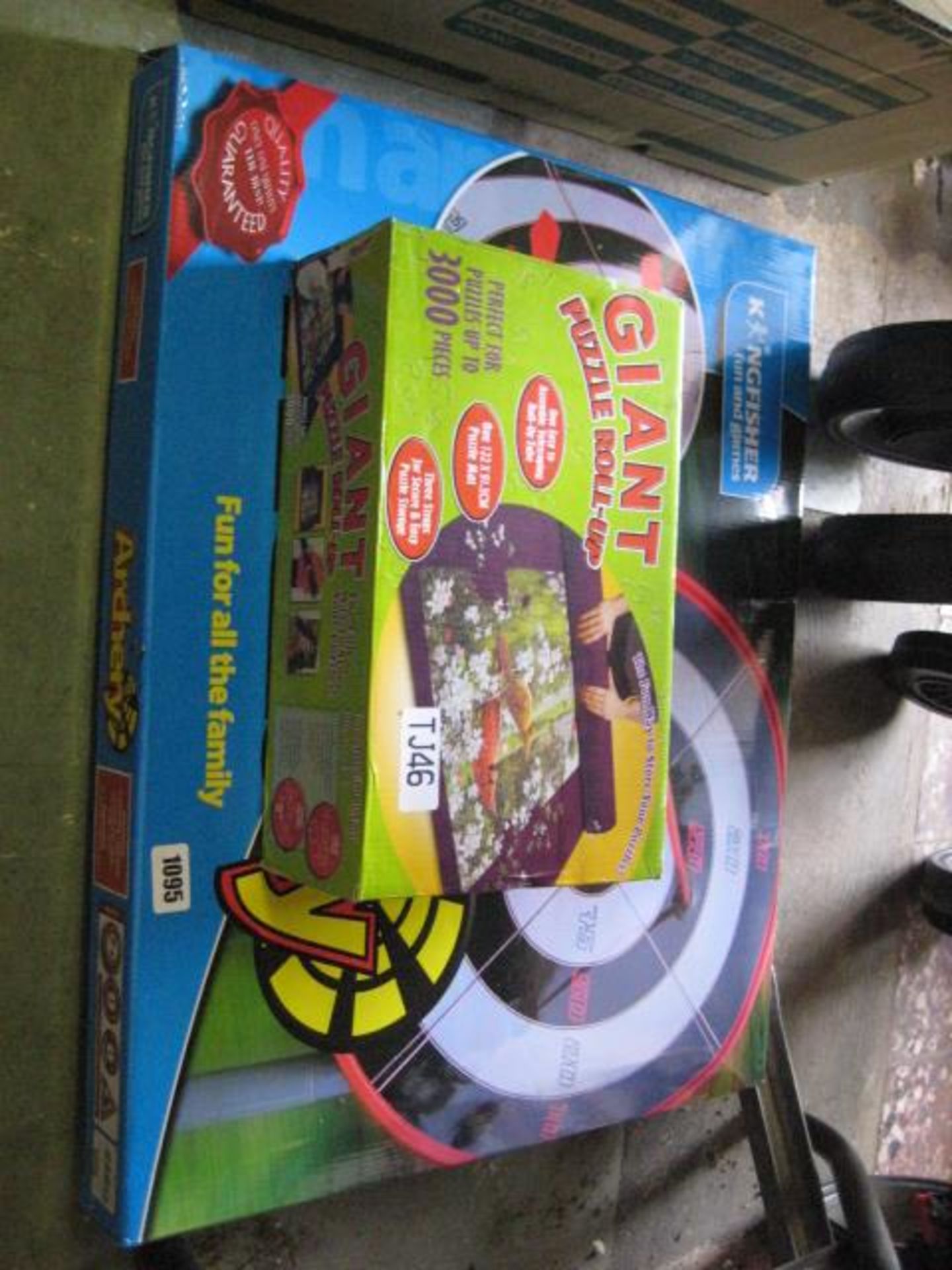 Childs outdoor archery game with giant roll up puzzle