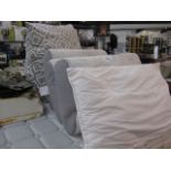 3 memory foam pillows, 1 loose pillow and wedge shaped cushion
