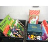 2 crates containing household games incl. Trivial Pursuit and others with 2 Action Men and loose