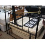 Black and brass metal bed end