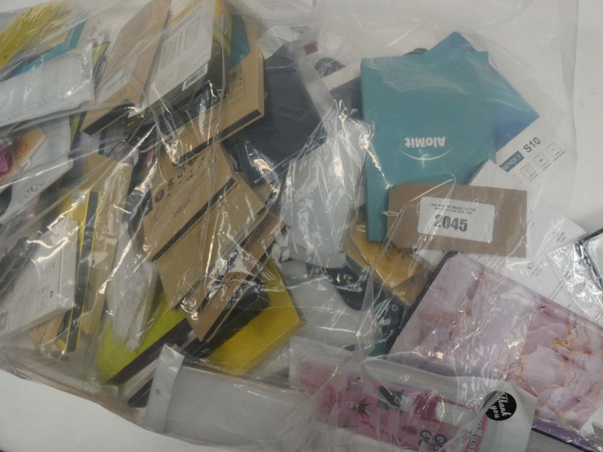 Bag containing quantity of various mobile cases and covers