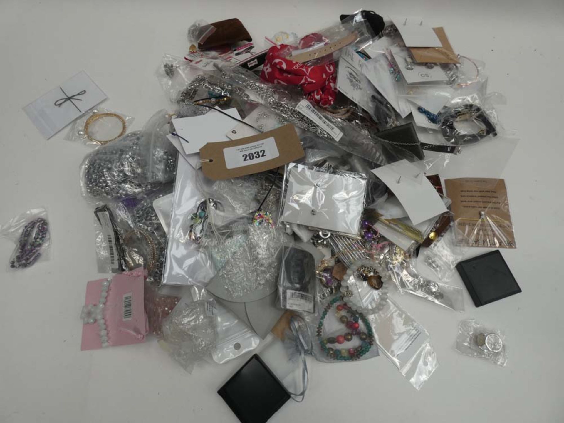 Bag containing quantity of various loose costume and dress jewellery