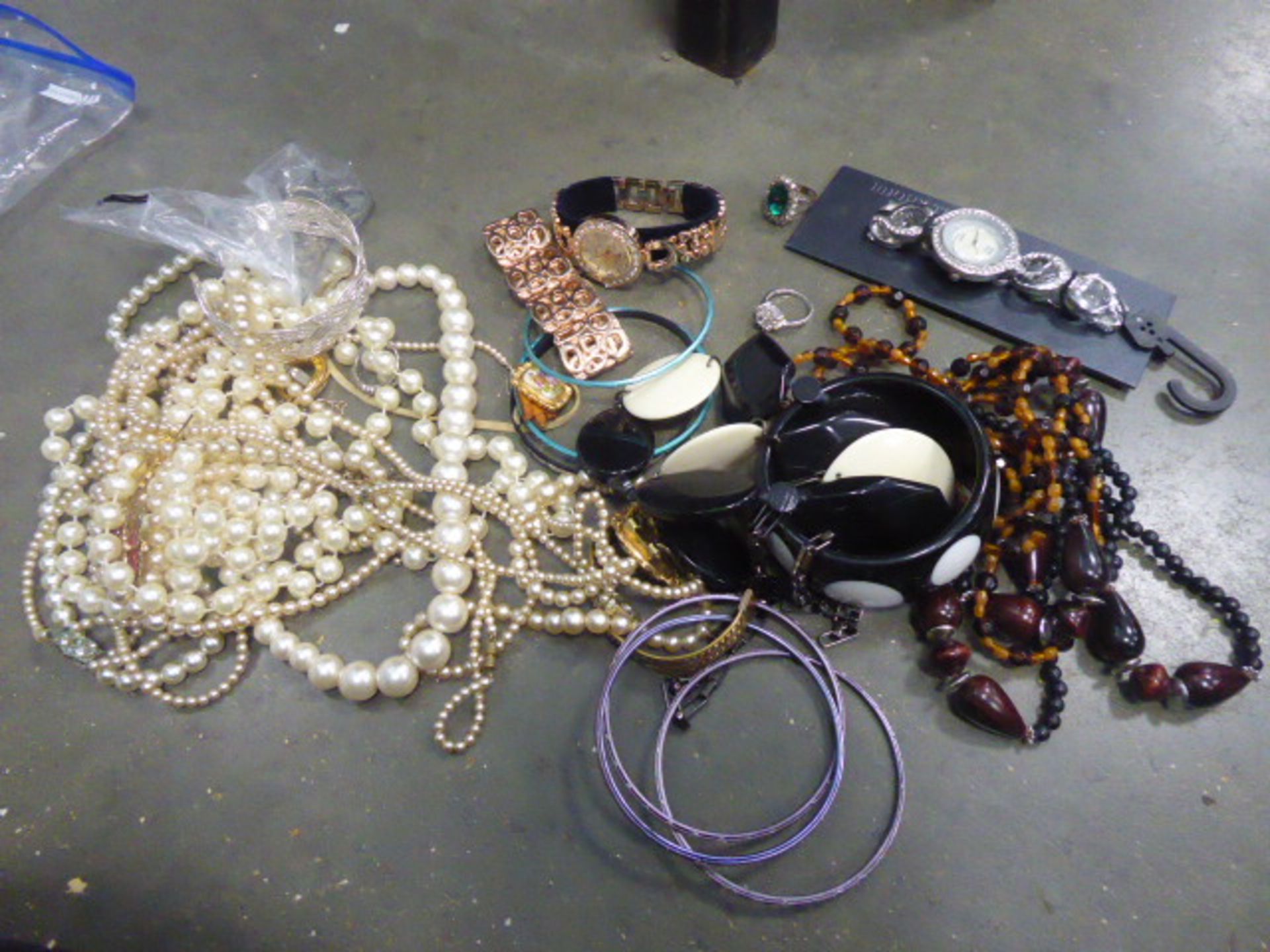 Bag containing loose costume jewellery items