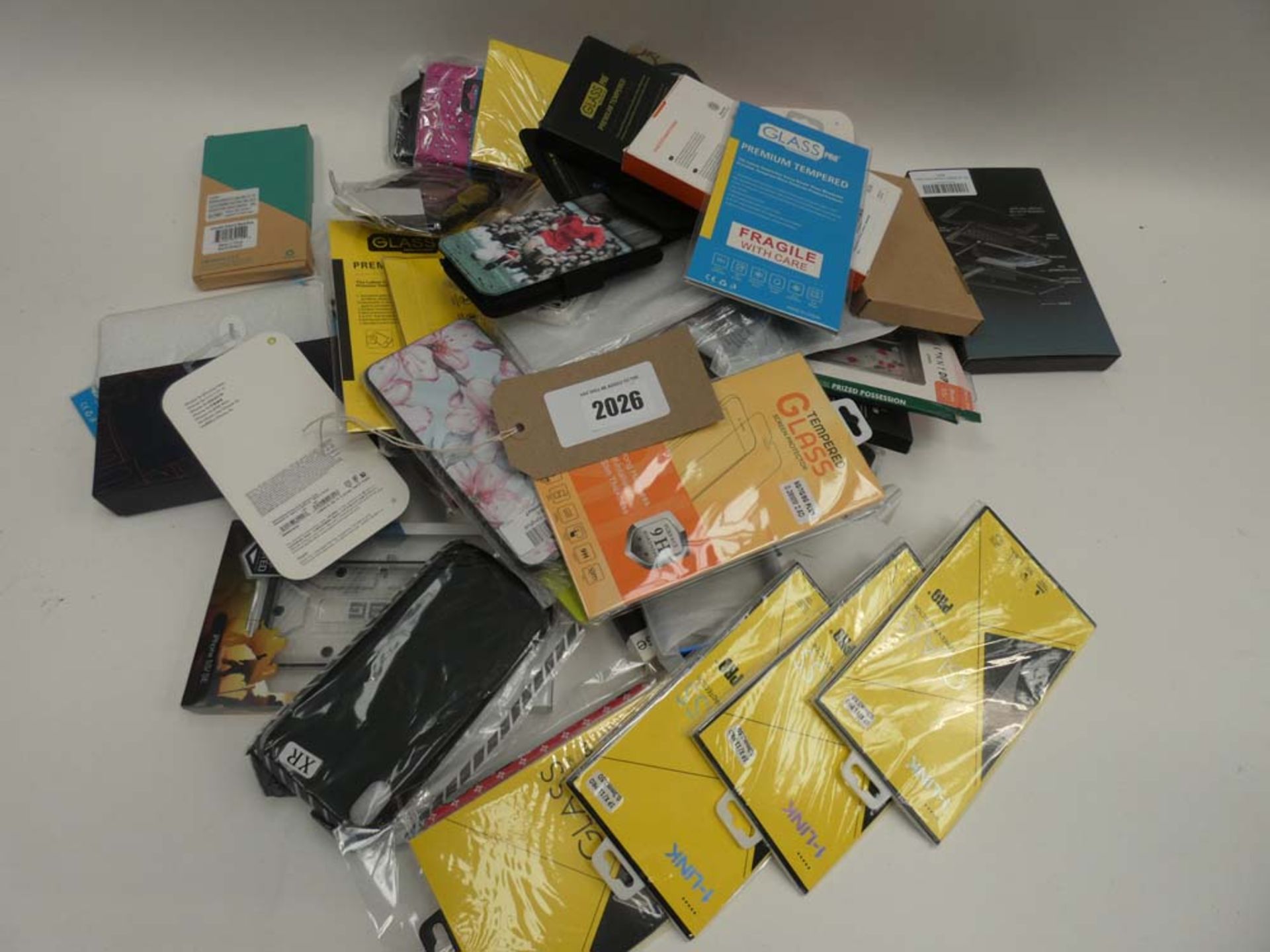 Bag containing quantity of various mobile phone covers and cases