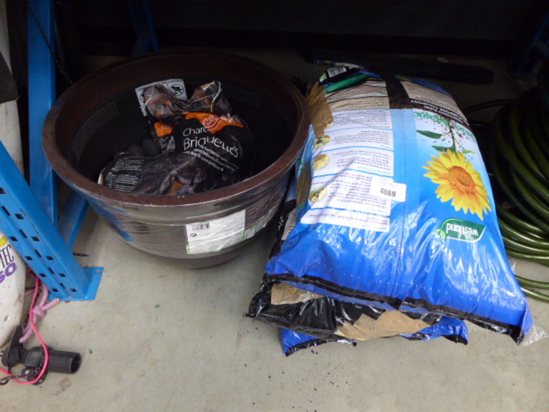 3 bags of compost, charcoal briquettes and plastic plant pot