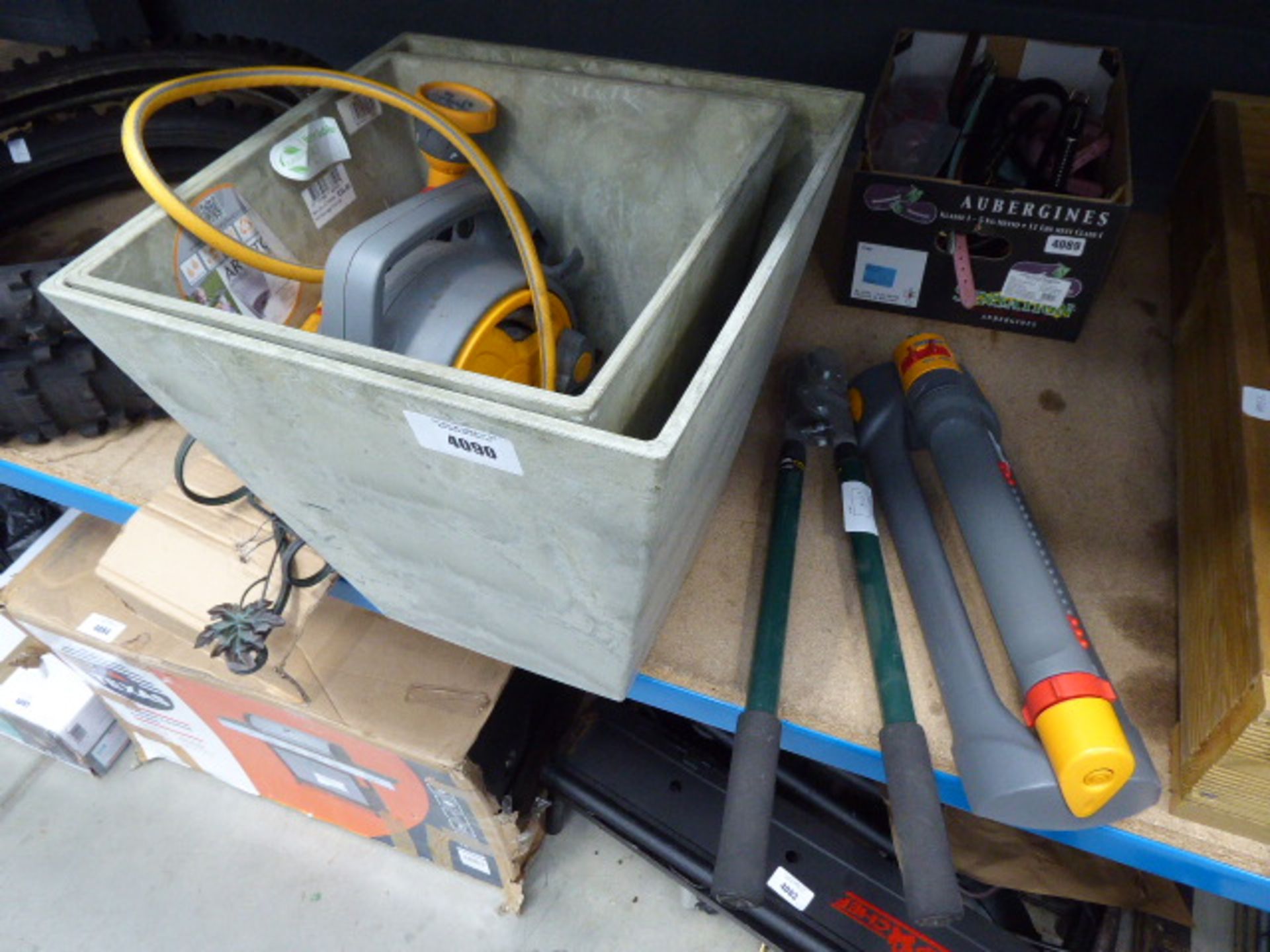 2 grey square flowerpots, pair of loppers, hose and a sprayer