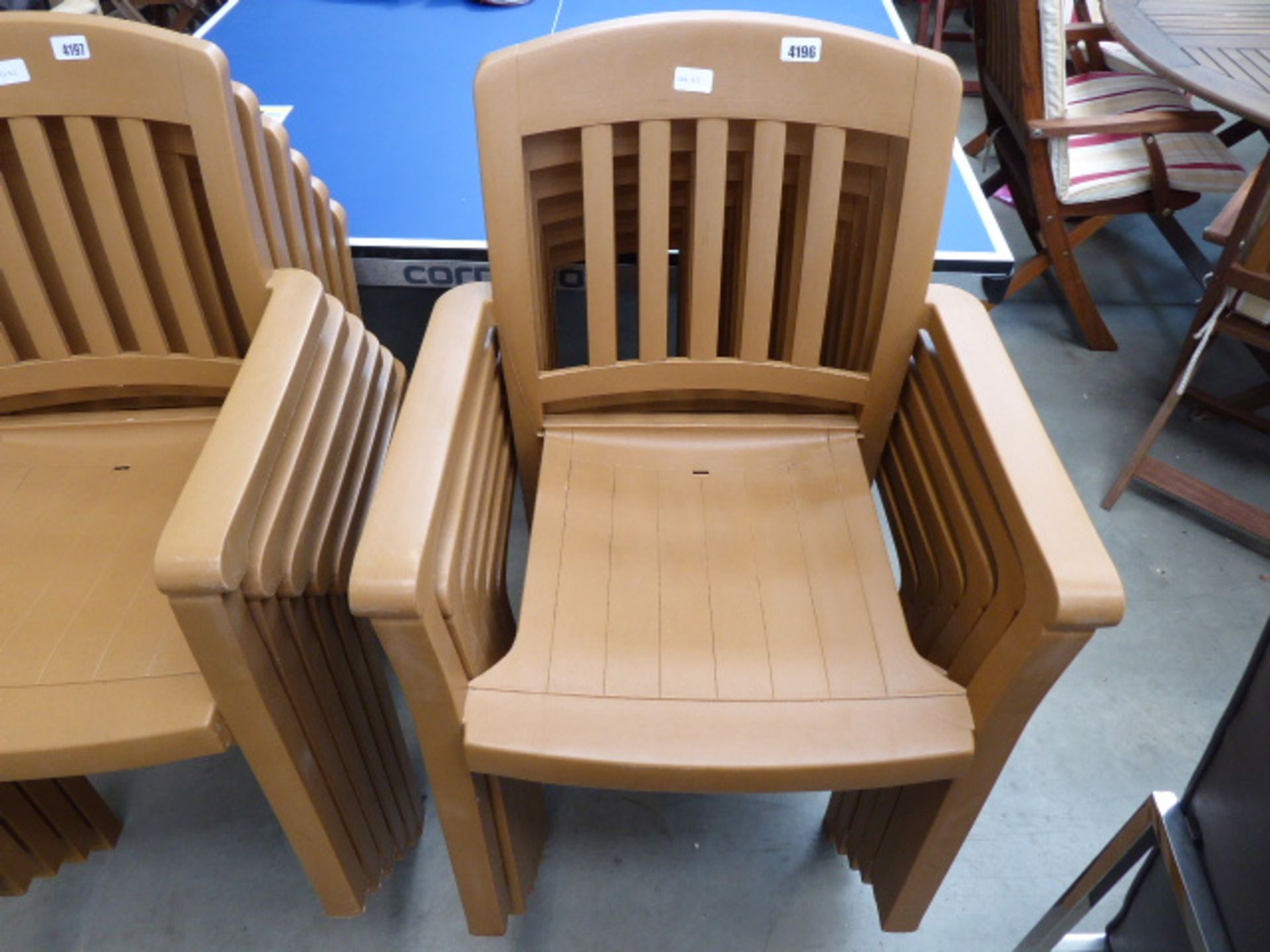 6 brown plastic stacking garden chairs