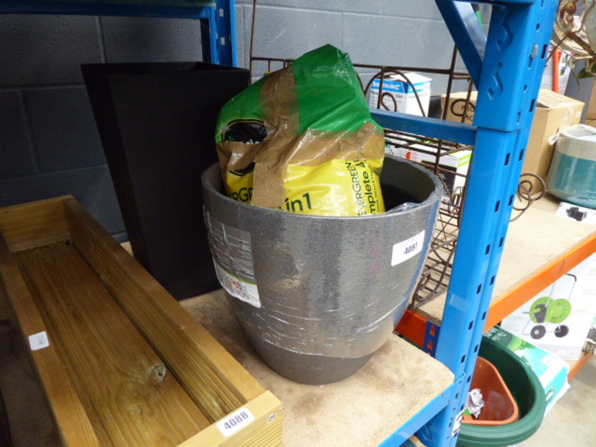 2 grey plant pots and some Evergreen weed control