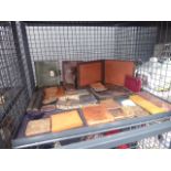 Cage containing a collection of leather purses