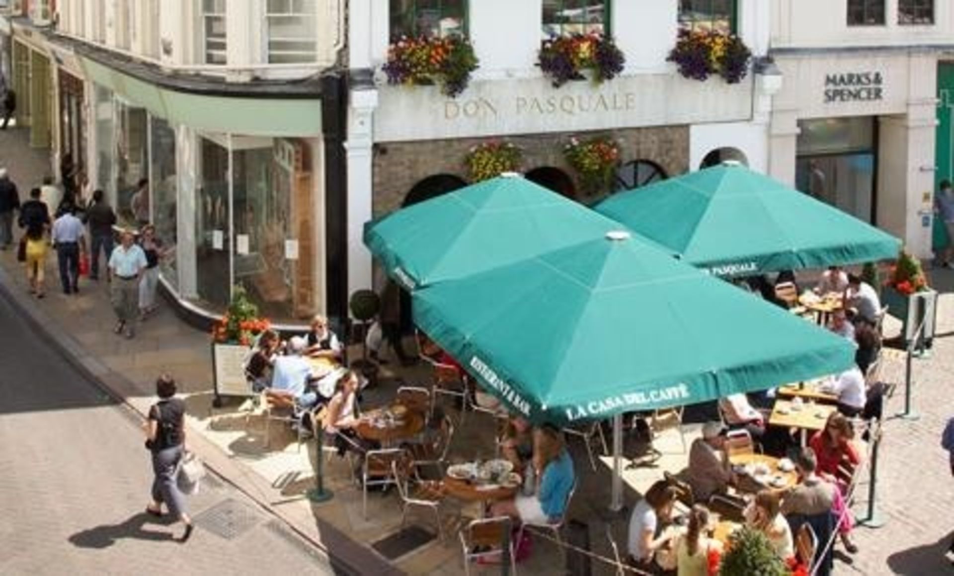 3 large restaurant terrace type umbrellas, each with a heatlight technology heat lamp system with