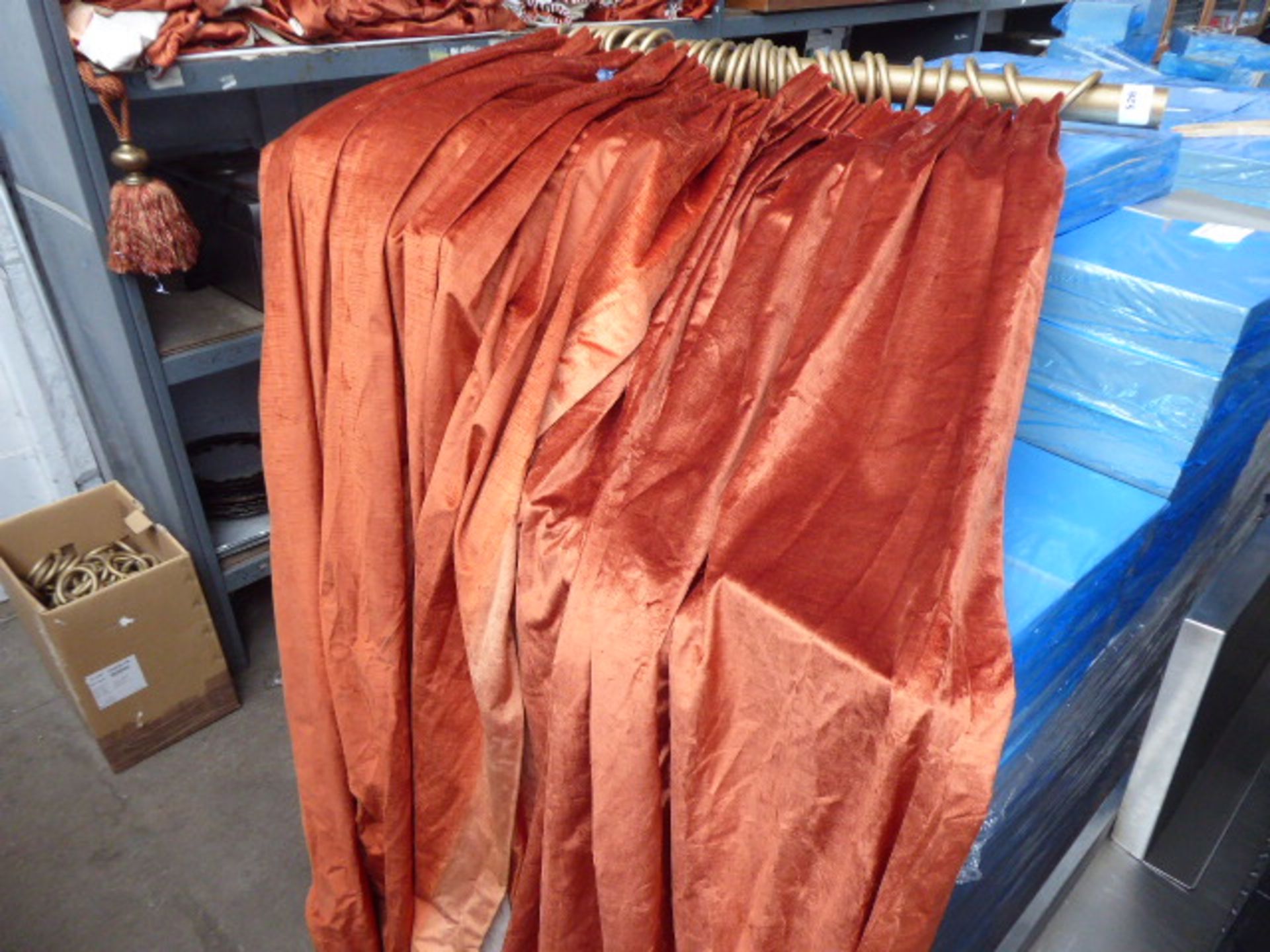 Approx. 6 large orange/bronze, velvet type texture, long drop curtains with a number of large