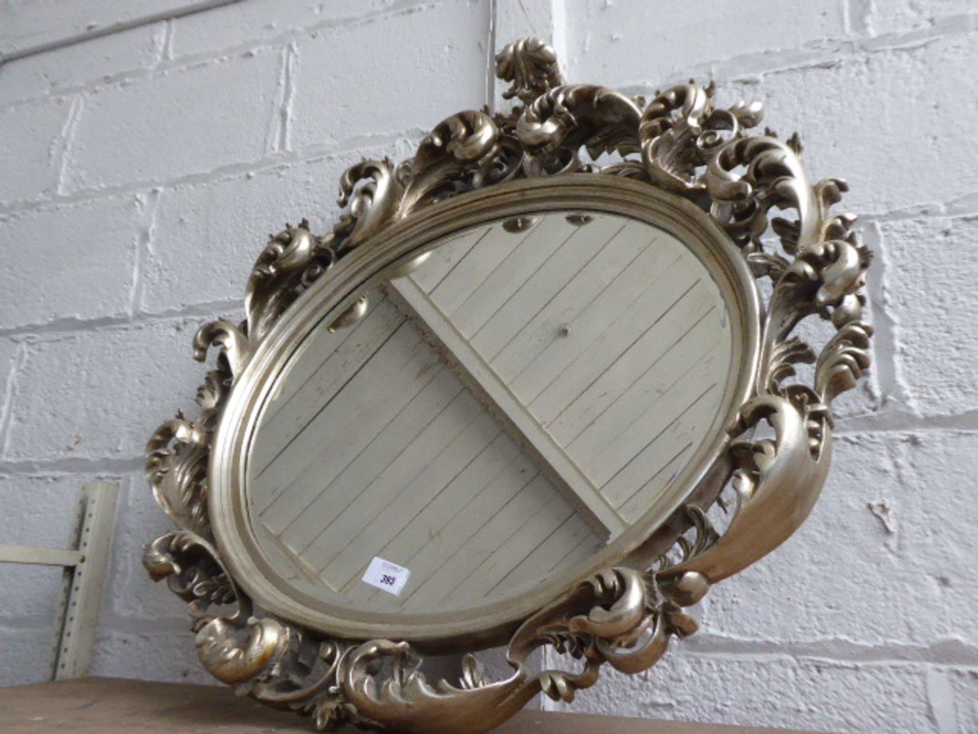 Large oval ornate mirror