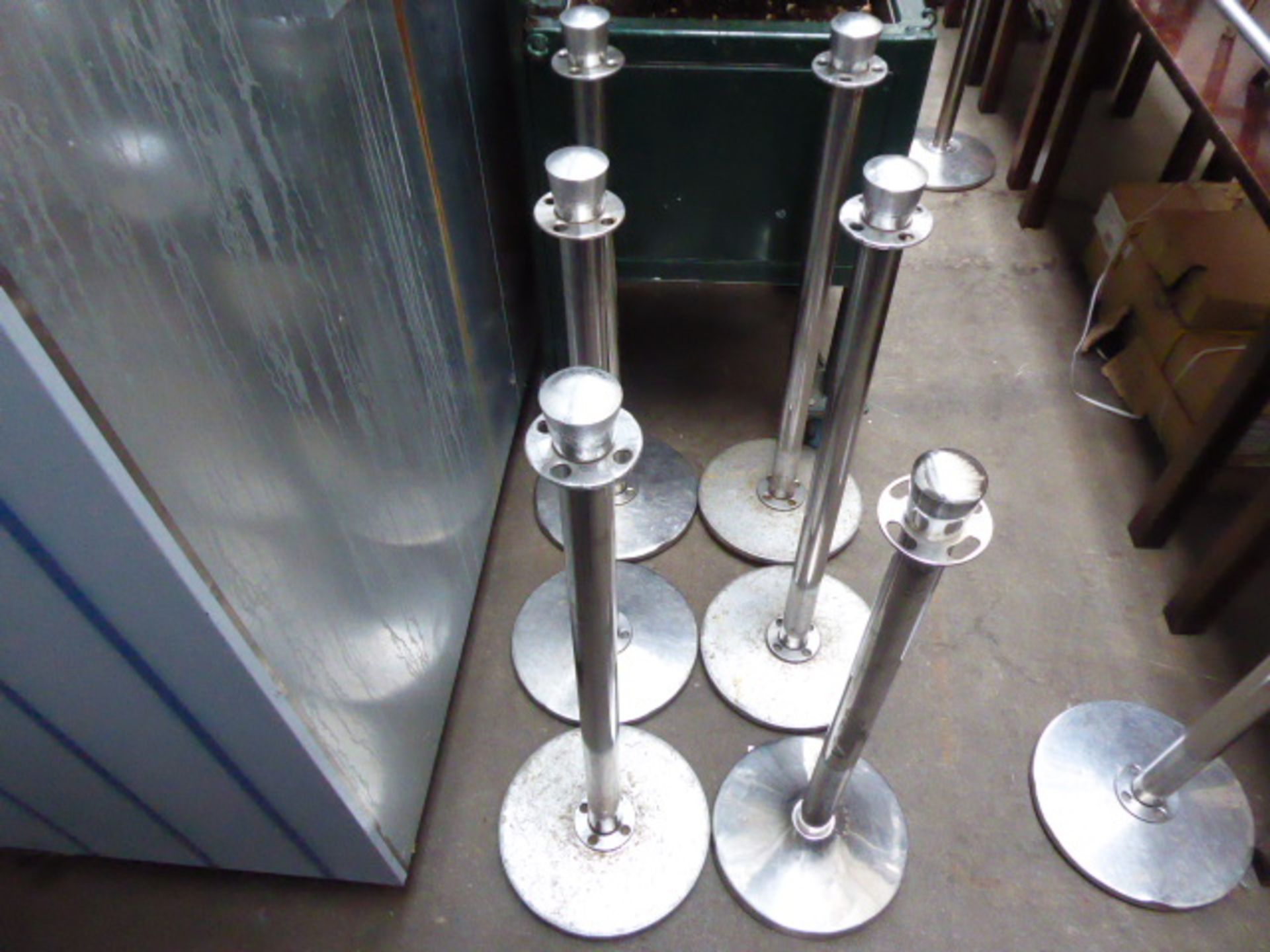 9 stainless steel bollards with a large number of associated metal bars plus 3 small boxes with