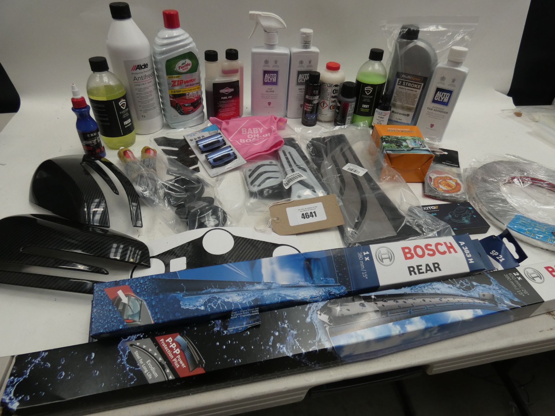 A large quantity of automotive items including liquids, trims, wiper blades and trims etc