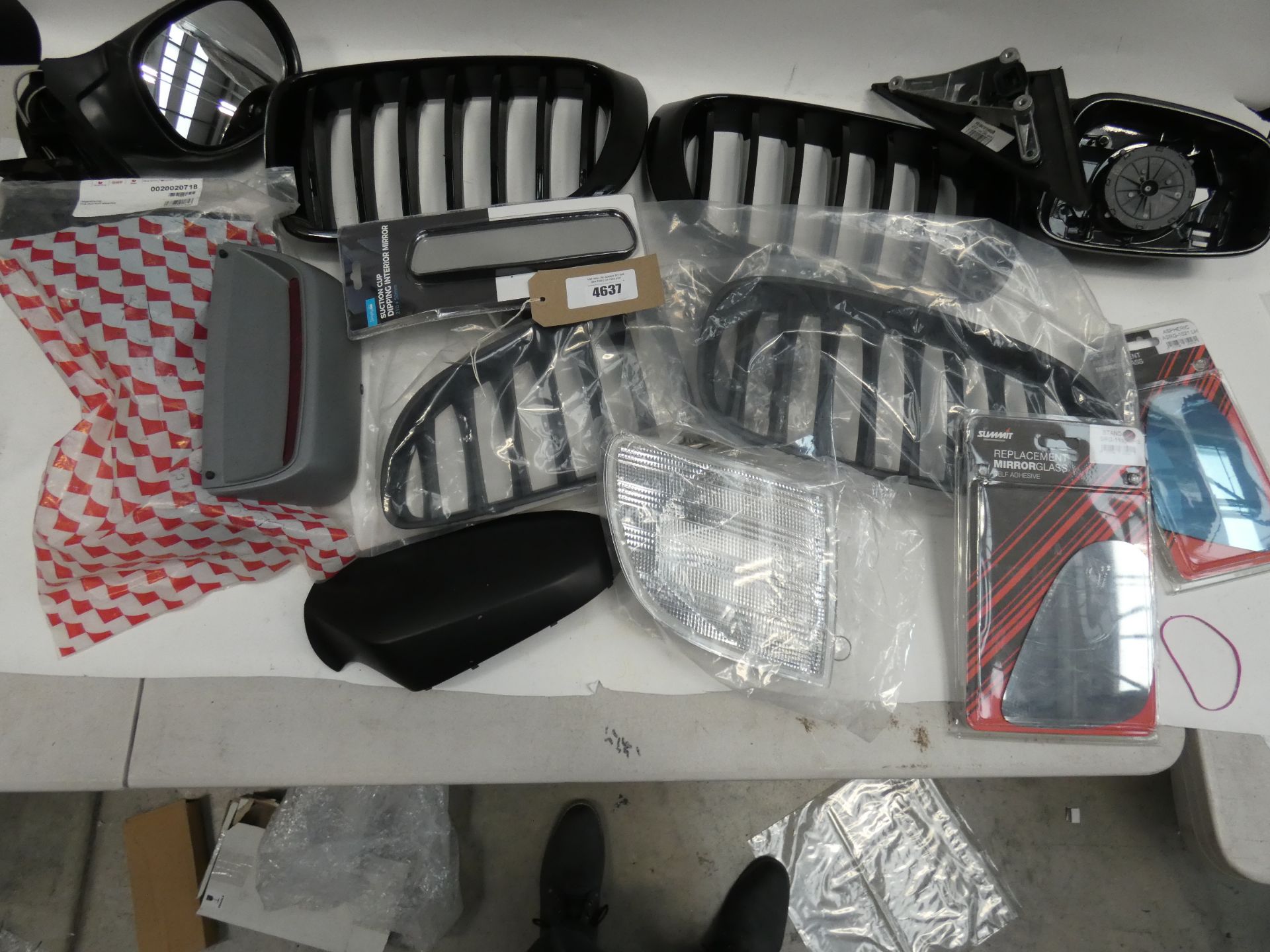 A quantity of car trims including front grills, wing mirrors and