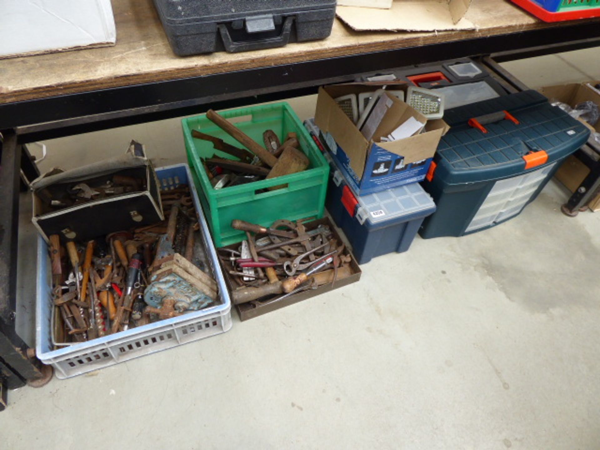 Large under bay of assorted tools and toolboxes inc. vices, hammers, lights, pliers, screwdrivers,