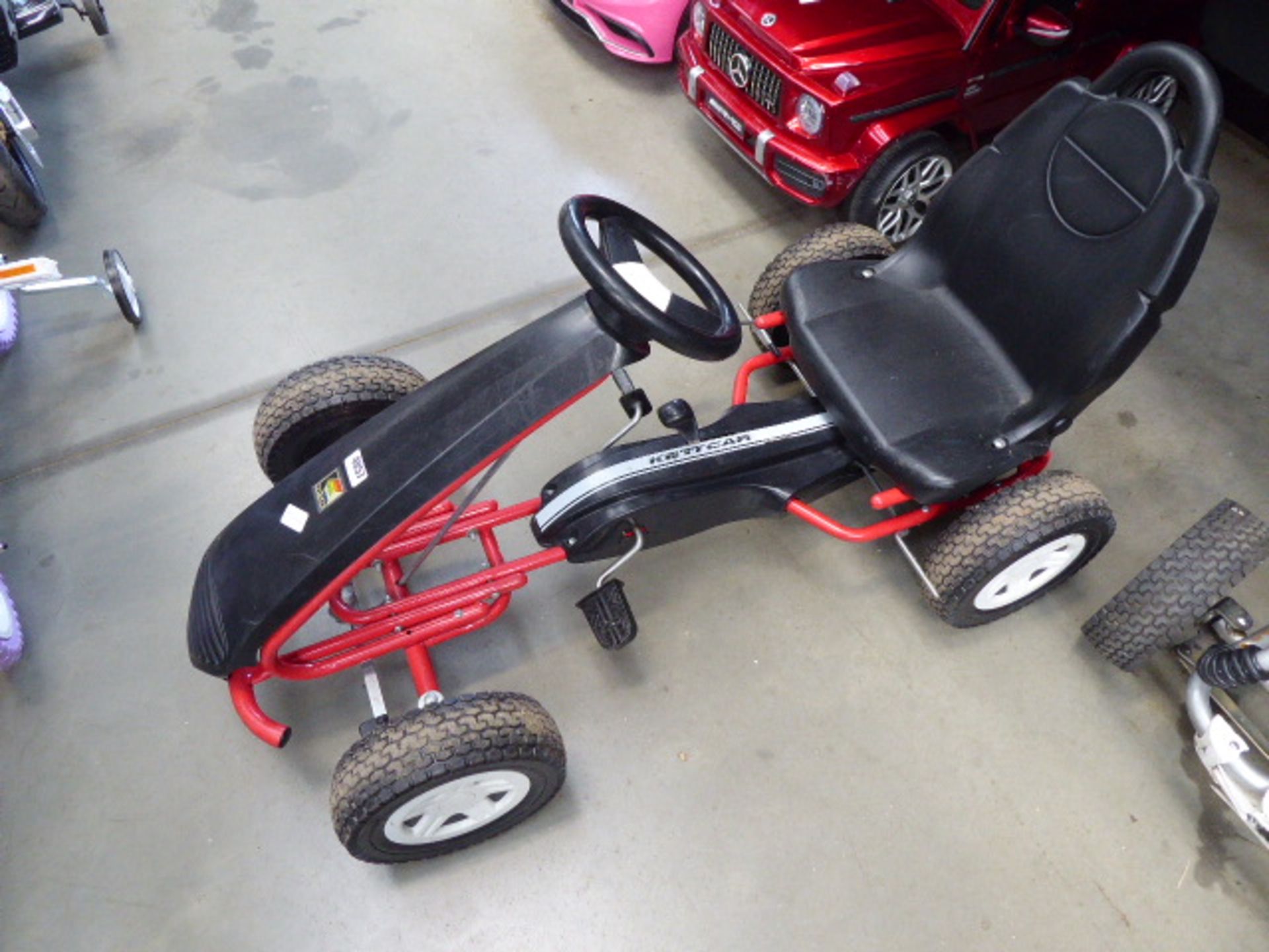 Keter red and black 4 wheeled go-kart