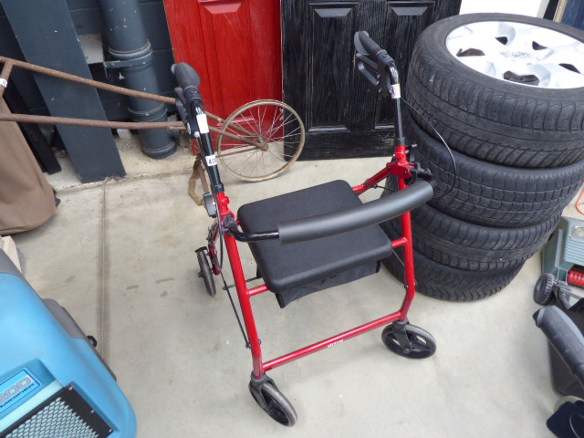 red mobility 4 wheeled walking aid