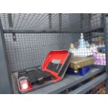 Cage containing cased cutlery sets, goblets, vanity set