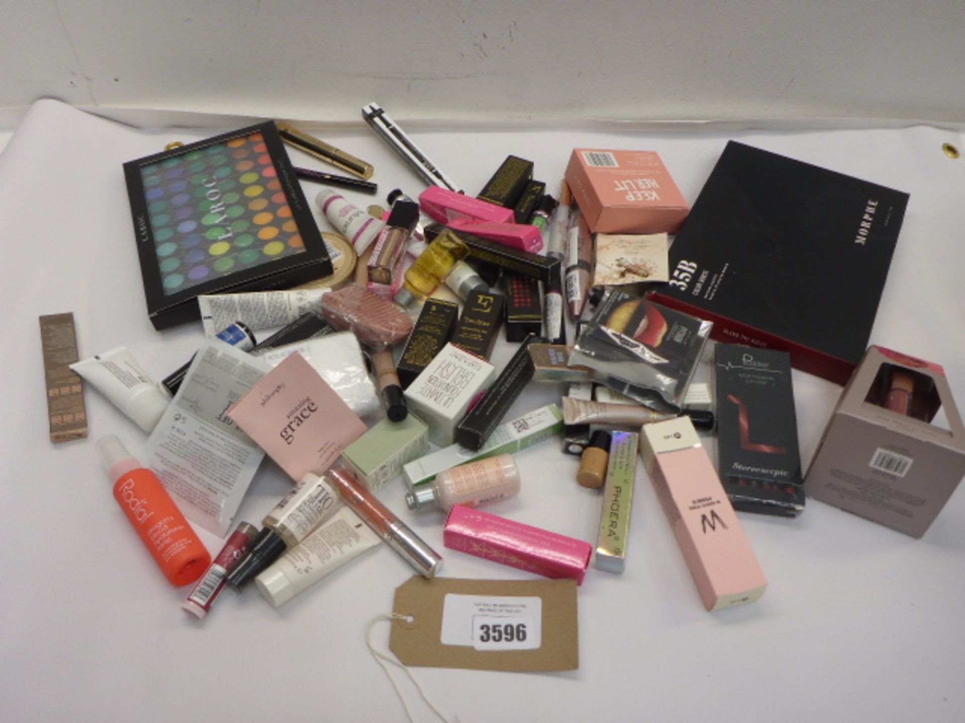 Selection of assorted cosmetics including eye palettes, mascara, lip stick etc