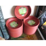 Quantity of circular flower pot trays