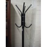 Free standing black metal hat and coat stand