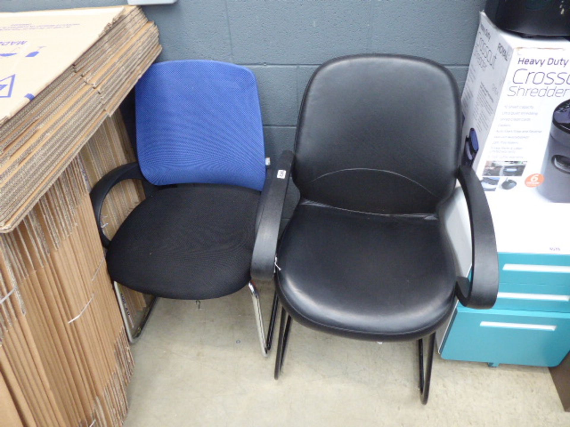 Black slide frame chair and another in blue