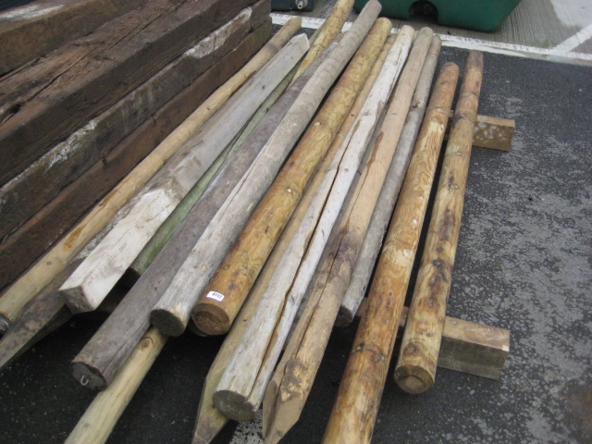 Quantity of various tanalised round pointed posts