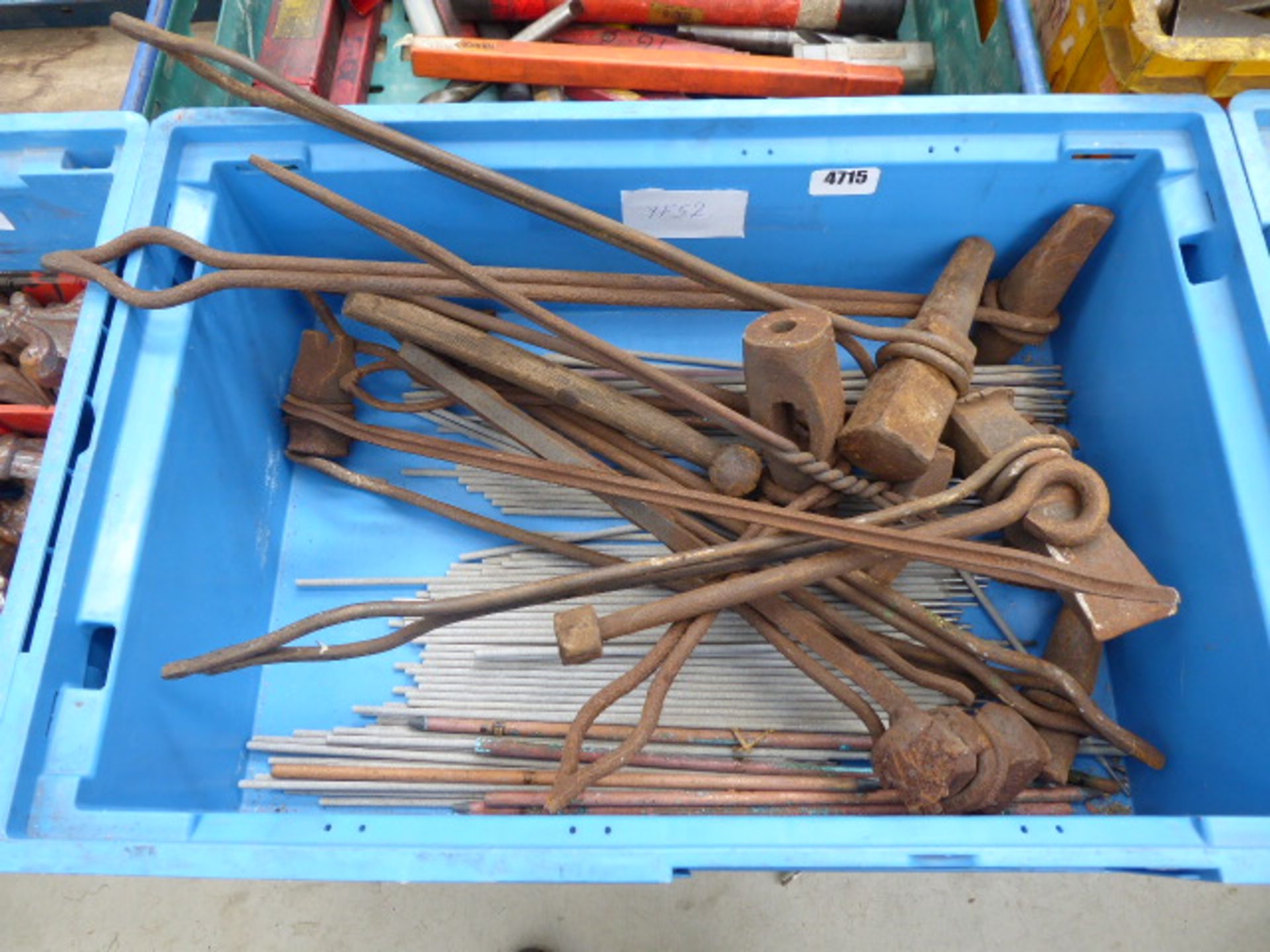 Box containing a quantity of welding rods and welding tools
