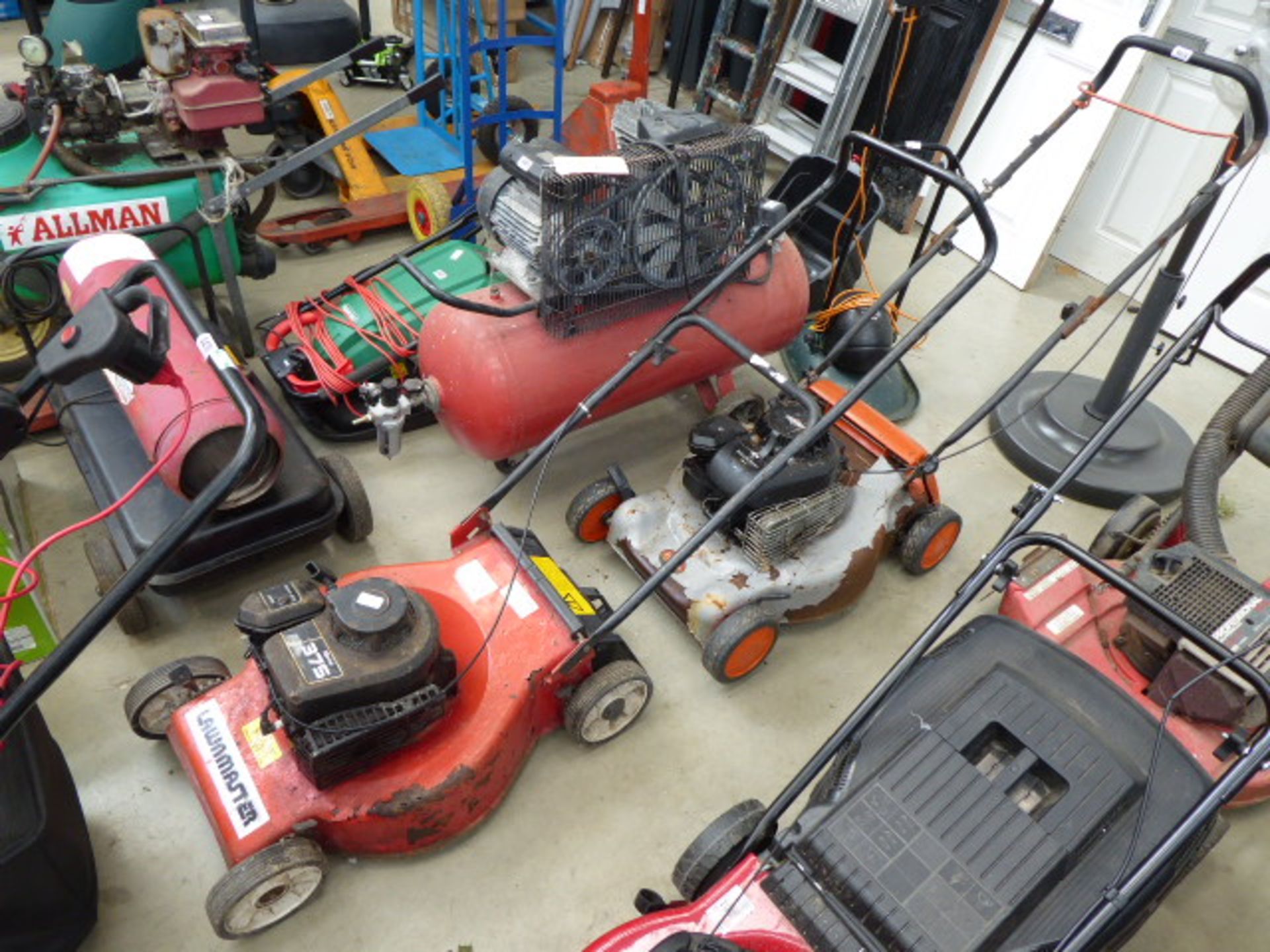 4248 & 4249 Orange and silver Flymo petrol powered rotary mower, no grass box and a Lawnmaster red