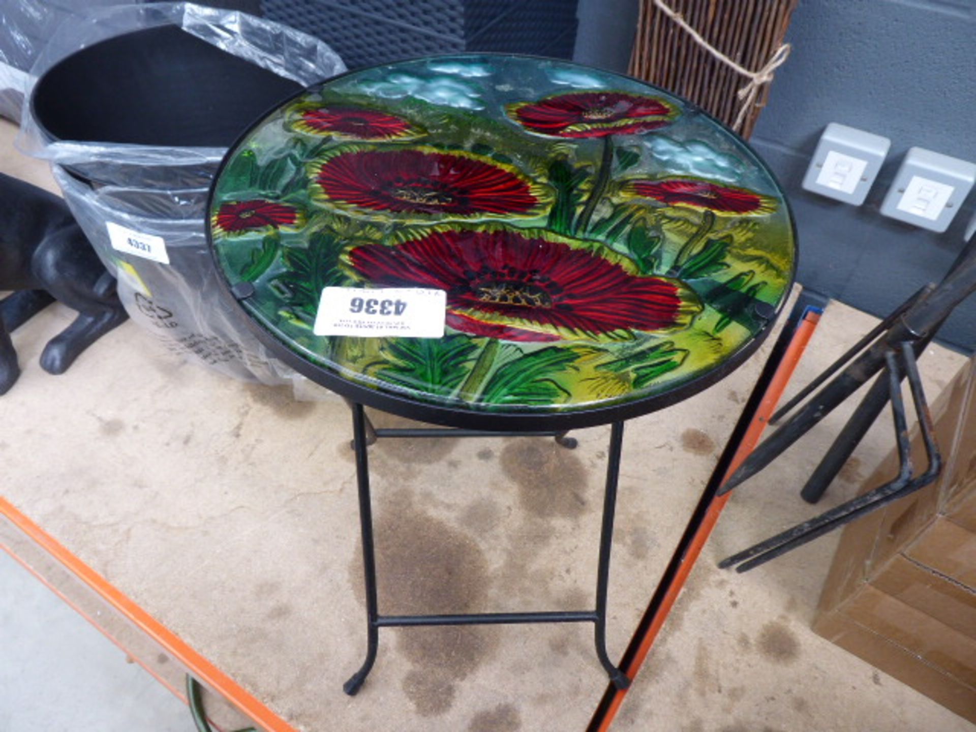 Small glass topped coffee table and a piece of trellis