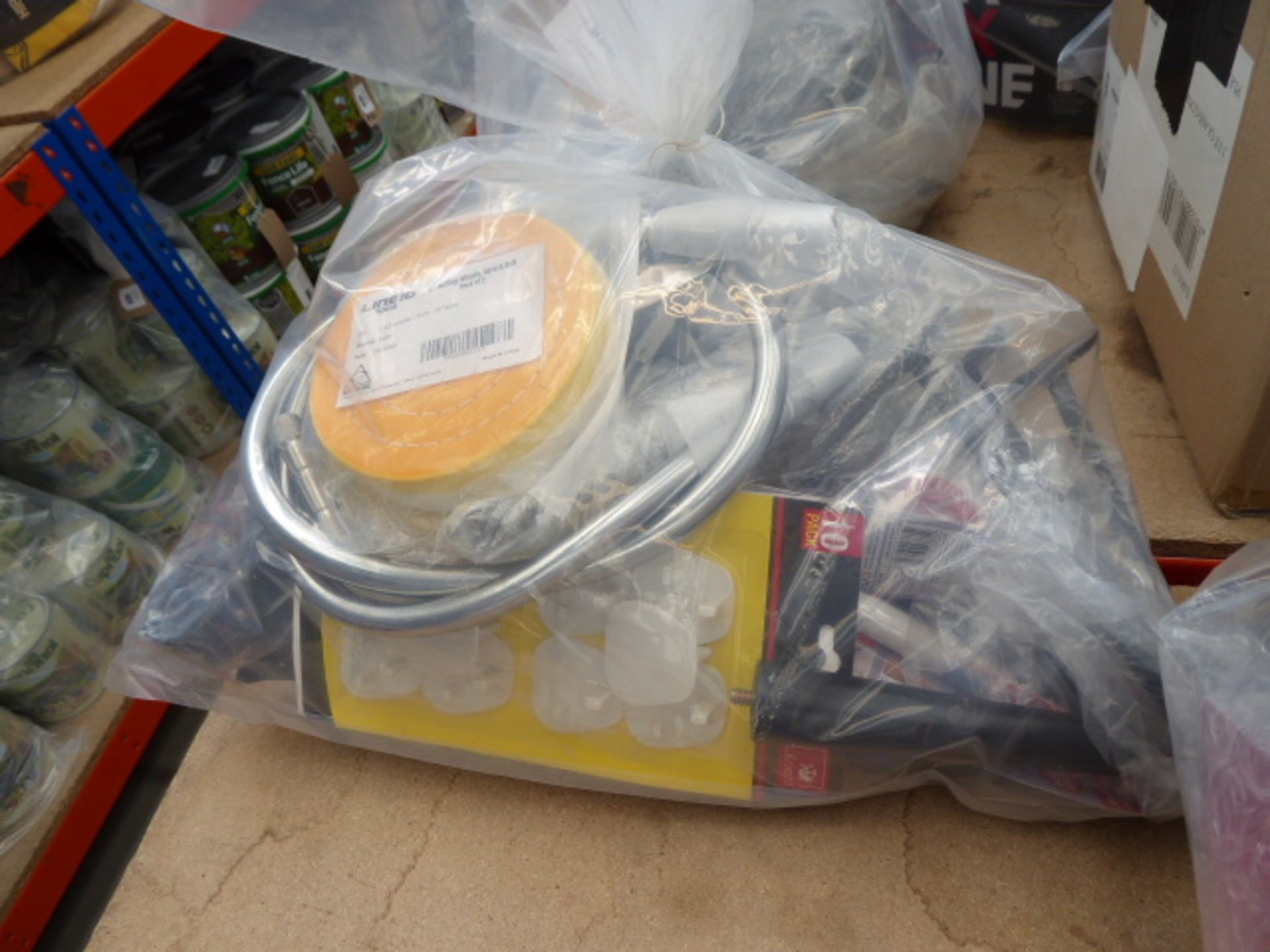 Bag containing cable, micrometers, drill bits, bike racks, buffing wheels, shower hoses etc.