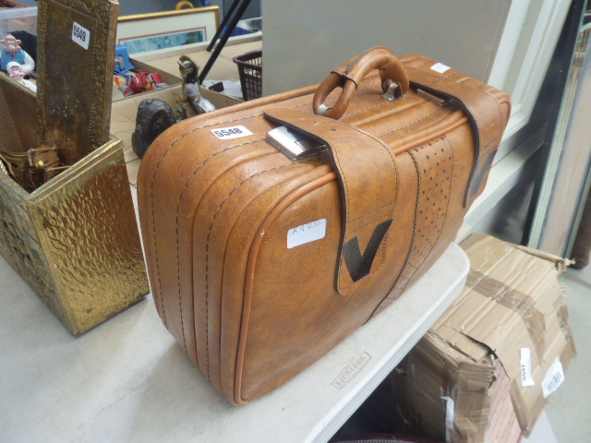 Set of graduated faux brown leather bags