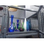 Cage containing coloured glass vases