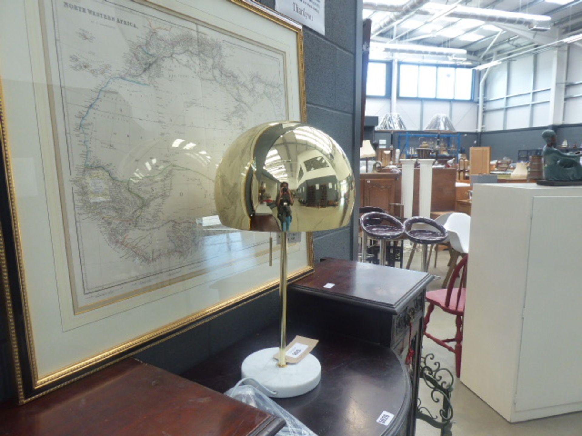 Brass coloured table lamp with marble base