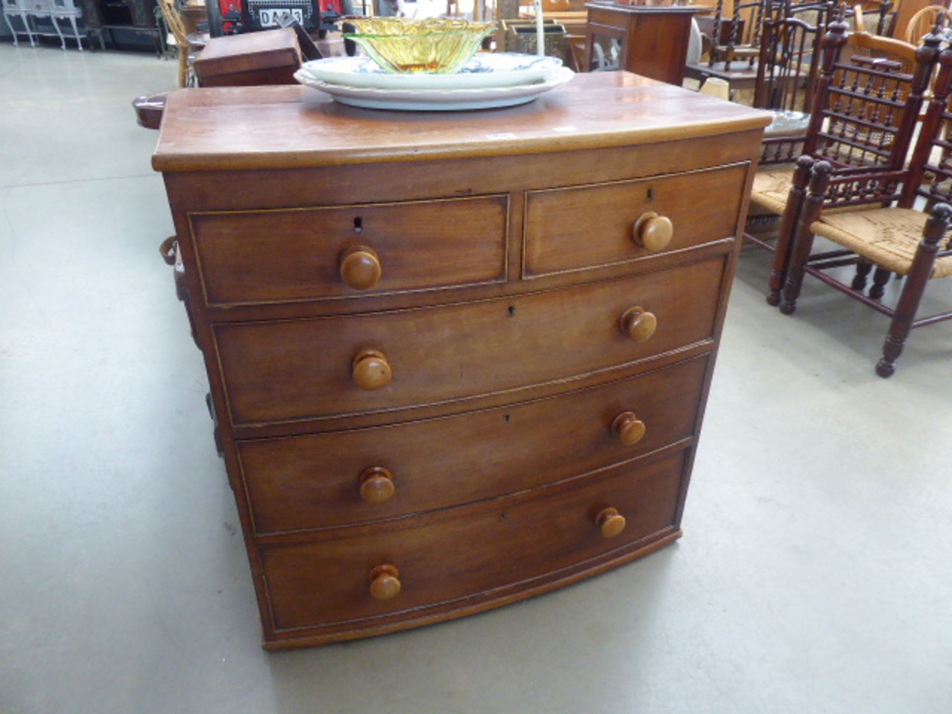 Mahogany bow fronted two over three chest of drawers