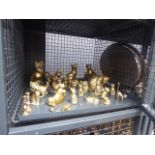 Cage containing ornamental brass cats