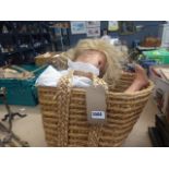 Wicker basket plus a child's doll