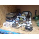 Cage containing cutlery sets, commemorative mugs, cigarette lighters, black forest style figure,