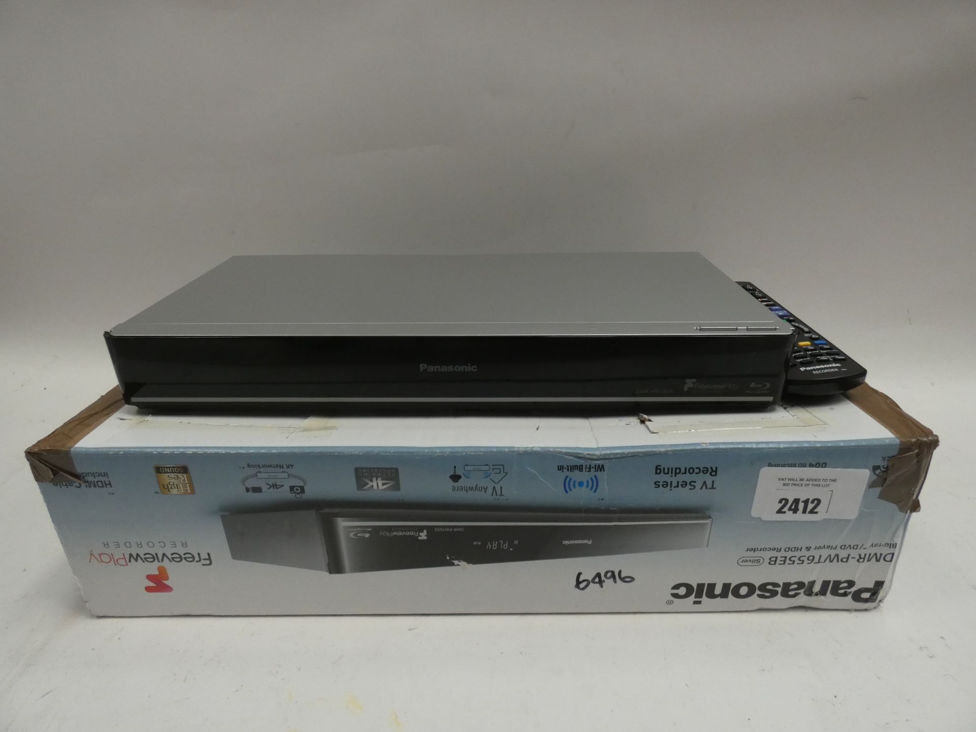 Panasonic DMR-PWT655 recorder with remote and box.