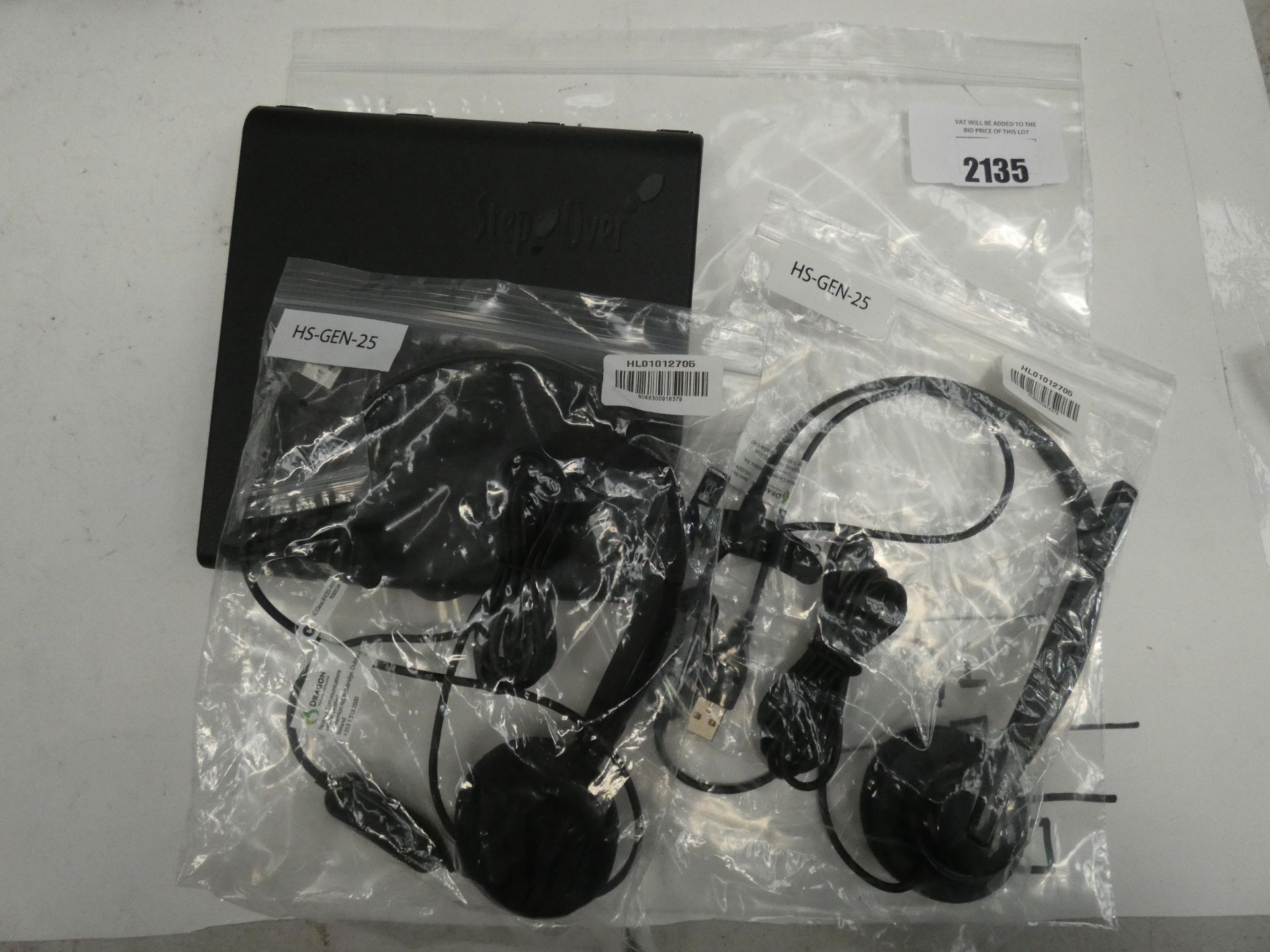 Two Dragon usb Operators headsets with a Step over signature pad.