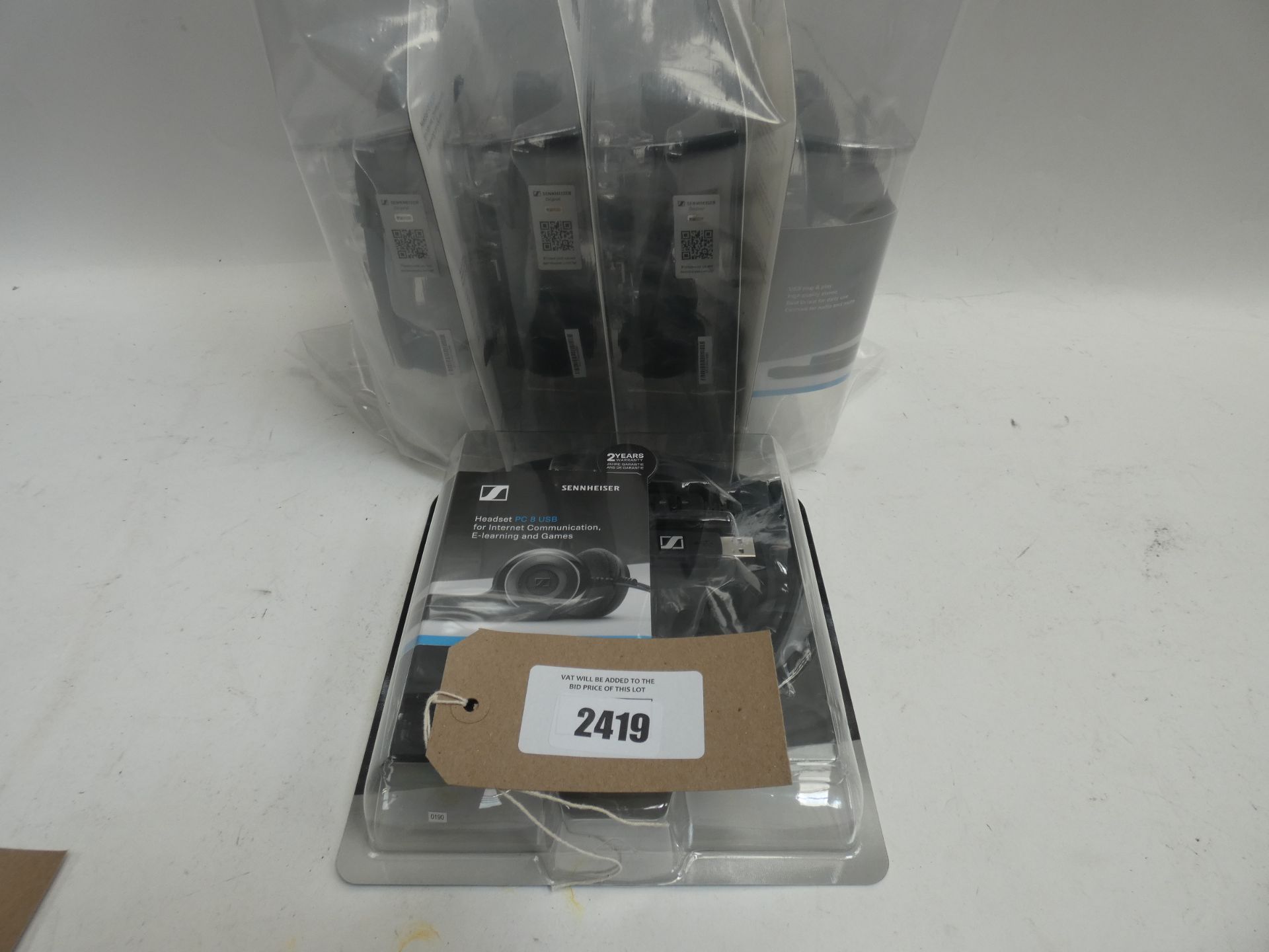 Bag of Five Sennheiser PC 8 usb headsets in blister packs.