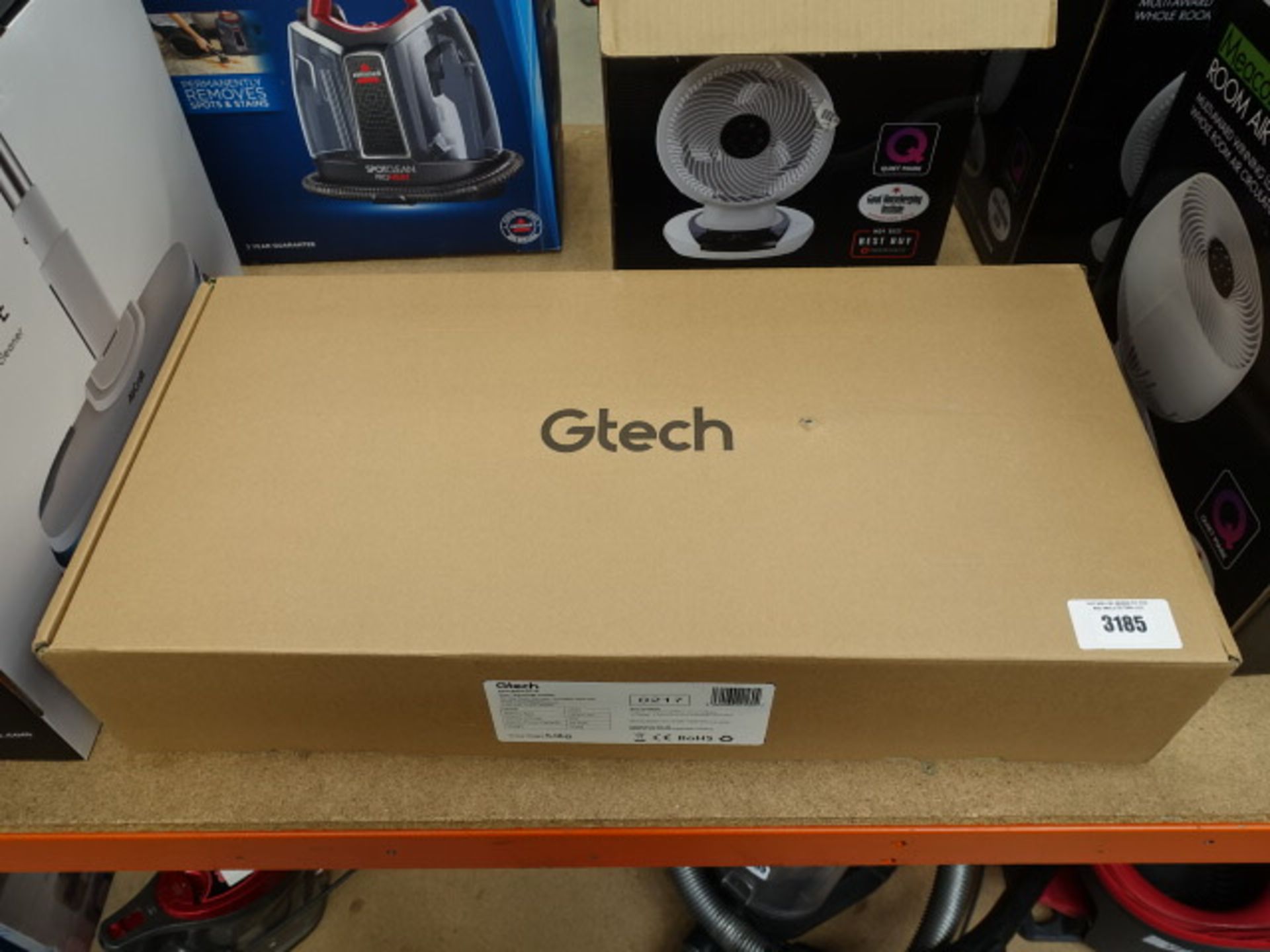 Boxed upright GTech AirRam with charger and manual