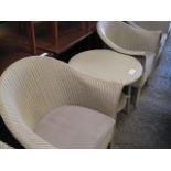 Pair of Lloyd Loom off white tub style dining chairs with matching circular coffee table