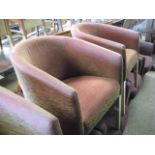 Pair of maroon and gilt fleck upholstered tub style restaurant seats by Morgan on tapered off