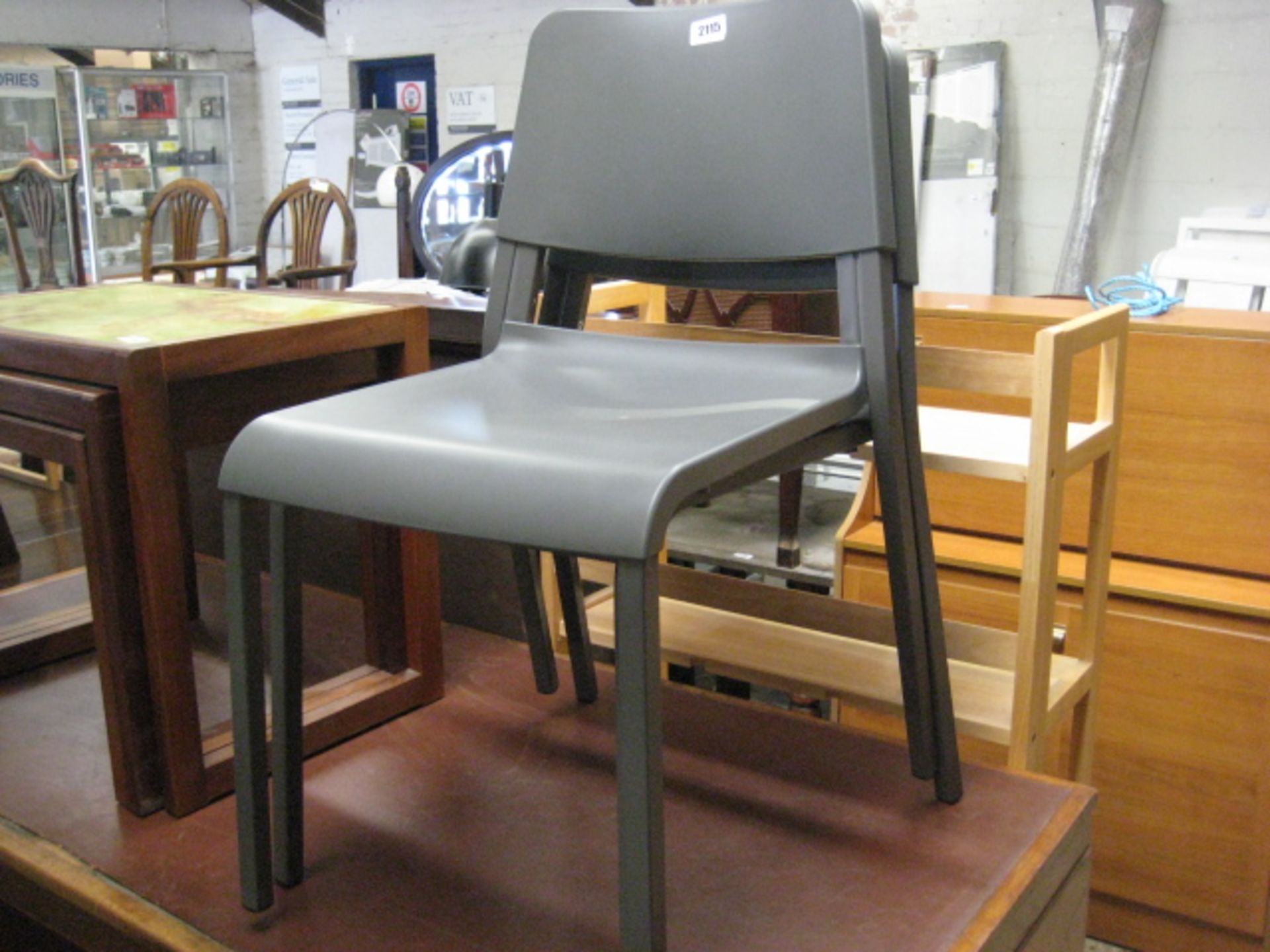 (2038) 2 grey stacking chairs