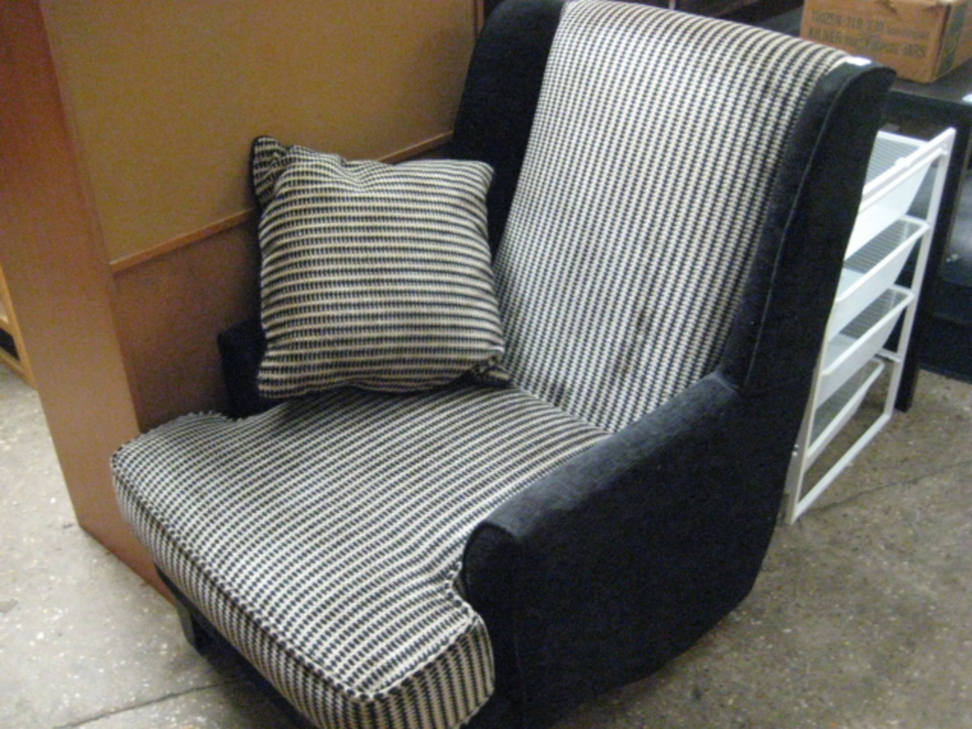 Black and white patterned deep arm chair