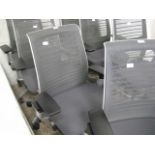 Steel Cases grey upholstered mesh back swivel office armchair