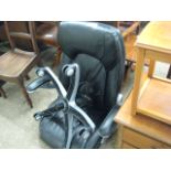 Black upholstered swivel chair, unassembled