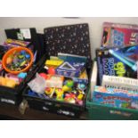 3 crates of various childrens games, toys, bike helmets, etc.